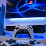 PlayStation 5 console with blue and white lighting, positioned on a modern entertainment setup, with a game controller in foreground, photorealistic, gaming environment