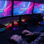 Frustrated gamer at gaming desk with multiple monitors displaying login error screens, hands on keyboard, modern gaming setup with RGB lighting and gaming peripherals