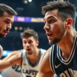 Close-up of college basketball players in intense defensive stance during game, sweat visible, focused expressions, arena lights in background, dynamic action shot