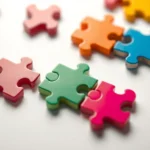 Close-up of colorful puzzle pieces perfectly fitting together on a minimalist white surface, soft lighting, shallow depth of field, photorealistic