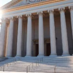 Professional courthouse building exterior with classical architecture, sunlight streaming through columns, no people visible, photorealistic, daytime setting, marble steps leading to entrance