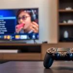 PlayStation 4 console sitting on entertainment center next to television displaying game menu, modern living room setting with controller in foreground