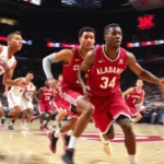 Alabama Crimson Tide basketball players executing fast break in dynamic action, professional arena lighting, motion blur showing intensity and speed